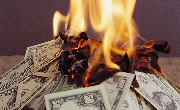 burning-wasting-money